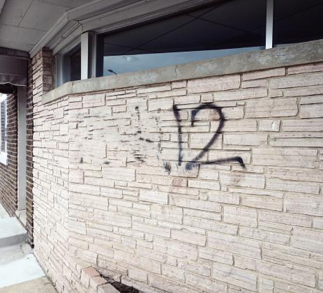 This wall on Noble Avenue was vandalised Friday night. Two persons have been arrested in connection with the spray paint, but other vandalism on the east side of town remains unsolved. The obscentity in this photo has been blurred for public consumption.