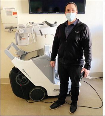 Kenny Thompson, Operations Managerfor Mercy Hospital Watonga, is shown with the facility’s new portable X-ray machine. Imaginging upgrades improve care, diagnosises and treatments.