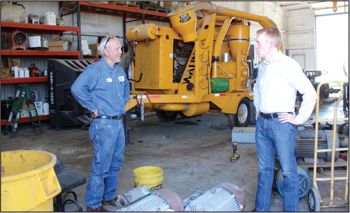 U.S. Senator james lankford paused Thursday during a tour of Wheeler Brothers to visit with one of the long time employees who was repairing motors for the company.