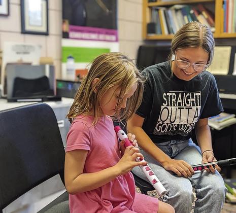 SWOSU Music Academy Junior Faculty member, Destyne Anderson, teaching flute lessons to a student enrolled in private lessons.