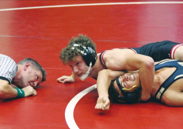 (Below) Bison varsity wrestling 160-pound senior Max Glasgow records a fall against opponent Paul Sullivan of Woodward High School on Dec. 20, 2019 at the annual Max Dippel Memorial wrestling tournament held at Weatherford High School.