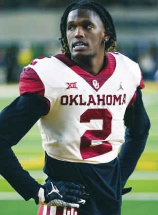 Ray Carlin AP Photo (Above) Former University of Oklahoma standout wide receiver CeeDee Lamb stands on the fiel;d on Nov. 19, 2019 during warmups prior to an NCAA college football game vs. Baylor University in Waco, Texas. Lamb was selected by the Dallas Cowboys on April 26 in the first round of the 2020 NFL Draft.