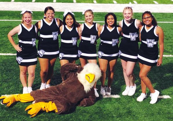 (Above) The Watonga High School varsity cheerleaders pose for a picture on the field with the Eagles’ mascot on Sept. 13, 2019, prior to Watonga’s 22-14 victory over the Alva Goldbugs in a game held at Northwestern Oklahoma State University. Photo Courtesy of Becky Cope Watonga Republican