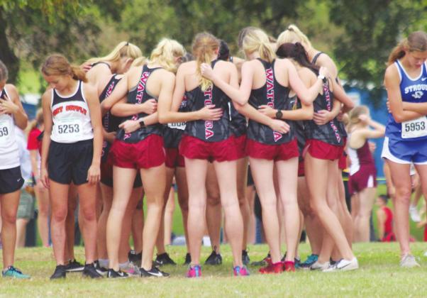 Photos by Andrew Salmi Watonga Republican The Watonga High School girls’ varsity cross country team huddles together on Oct. 3, 2019 prior to the Oklahoma Baptist University Pre-State Challenge held in Shawnee. With this week’s news that all Oklahoma school will be closed until at least April 6, Watonga Eagles’ and Lady Eagles’ athletics for the spring 2020 season have been suspended until further notice.