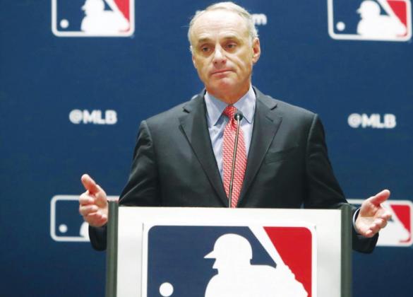 (Above) In this Nov. 21, 2019, file photo, baseball commissioner Rob Manfred speaks to the media at the owners meeting in Arlington, Texas. The chance that there will be no Major League Baseball season increased substantially Monday, June 15, 2020, when the commissioner's office told the players' association it will not proceed with a schedule amid the coronavirus pandemic unless the union waives its right to claim management violated a March agreement between the feuding sides. LM Otero AP Photo