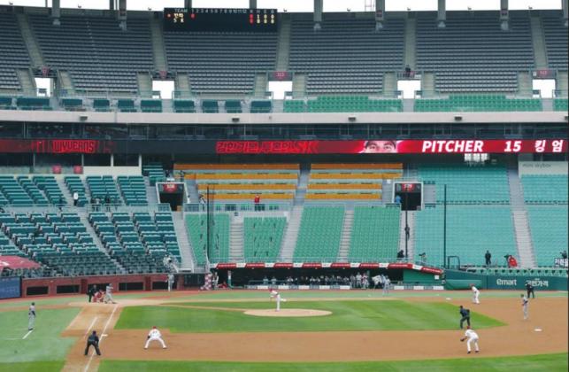 Stadium seats are empty as a part of precaution against the new coronavirus during a baseball game on May 5 between Hanwha Eagles and SK Wyverns in Incheon, South Korea. With umpires fitted with masks and cheerleaders dancing beneath vast rows of empty seats, a new baseball season got underway following a weeks-long delay from the coronavirus pandemic. Lee Jin-man AP Photo