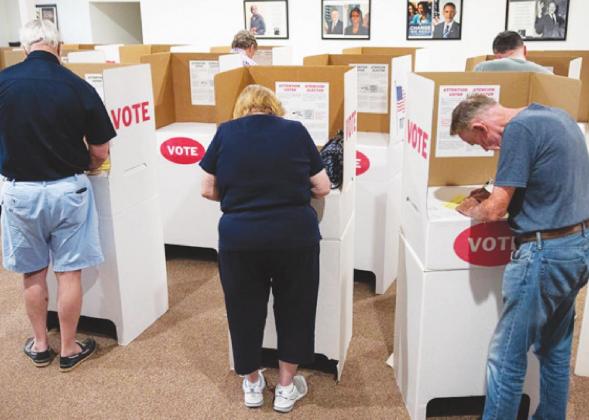 Voters are seen casting their ballots for the primary election at the St. James AME Church in Arcadia on June 28, 2022. (Whitney Bryen/Oklahoma Watch)