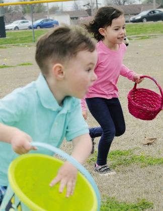 As soon as the horn sounded Saturday, youngsters raced toward the eggs scattered around the baseball fields at Huff Lorang Park in Watonga in the annual Kiwanis Easter Egg Hunt. The plastic eggs were filled with candy, and toys. Photo by Connie Burcham