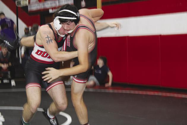 A Duncan wrestler puts a tough take down Friday on Geary’s Mark Perez.