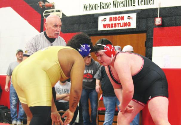 Tony Davidson (right) faces off against a wrestler in a match last year.