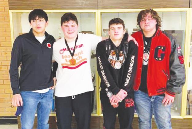 (From left to right) Marc Perez, Tony Davidson, Spencer Davidson and Chris Ward pose for a group photo after earning their medals. Photo provided by Geary High School