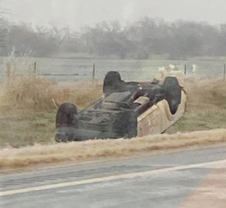Right: Car flipped over in ditch after accident due to icy roads. (Photo provided by Reanna Goodnight)