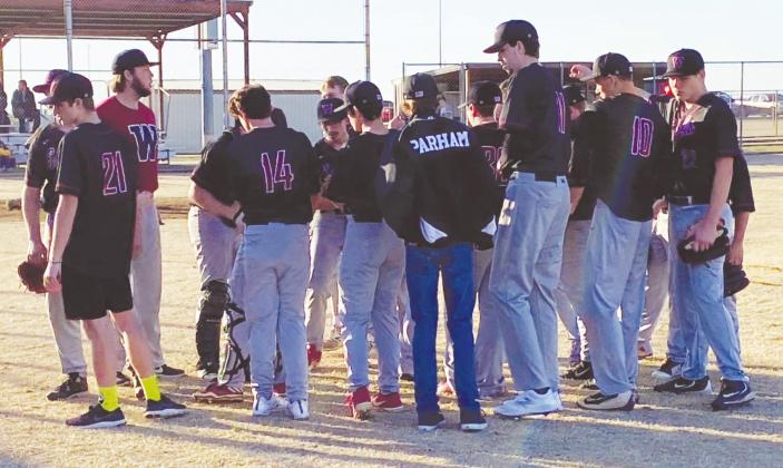 Andrew Salmi I Watonga Republican (Above) The Watonga High School varsity baseball team huddles together in between innings on Monday, March 2 during the Eagles’ season opener at home against Amber-Pocasset High School. The Eagles fell to the Panthers, 10-0.