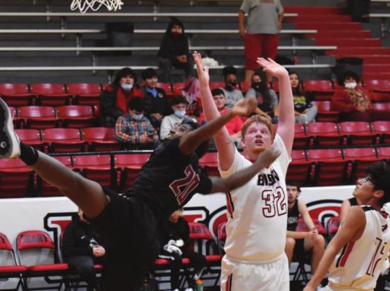 Geary’s Keaton Akridge goes up for two points in front of a sprawling Watonga defender. The team lost to Watonga, 71-44. (Photo provided by Brenda Geels)