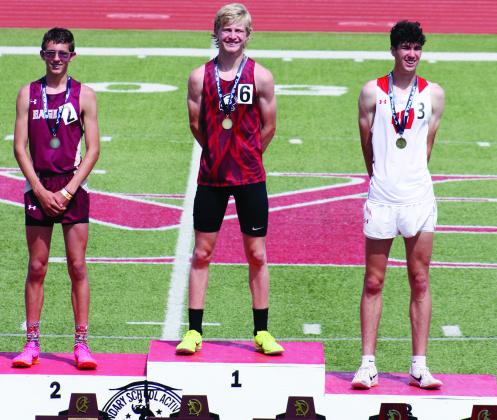 Brayden Cowan took the podium to claim his gold metal for the state championship in the 3200 meters.