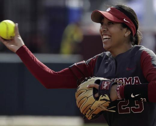Oklahoma’s Tiare Jennings reacts during an NCAA college softball game May 19 against Hofstra in Norman. Oklahoma will seek its third straight national softball title and seventh championship overall at the Women’s college World Series. AP Photo/Garett Fisbeck
