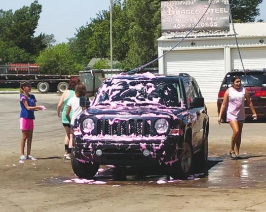 Lady Bison Softball Holds Car Wash Fundraiser
