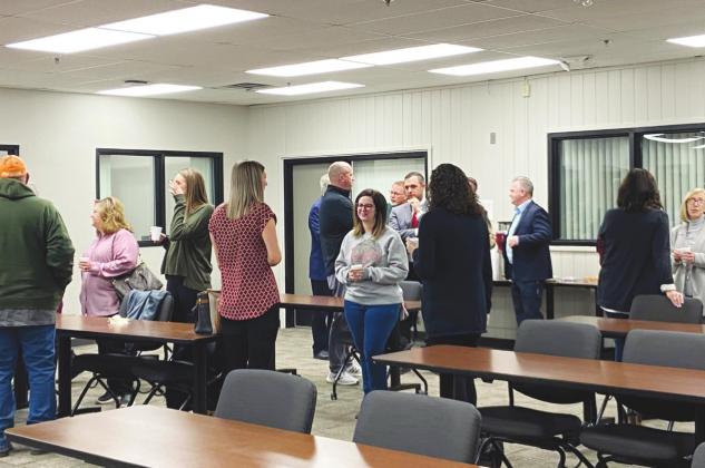 Locals mingle in the Watonga Middle School meeting room at the Watonga Chamber's Community Coffee event on Tuesday, Feb. 8. The school hosted the event on Election Day as the district sought approval for a $20 million bond to finance extensive new construction.