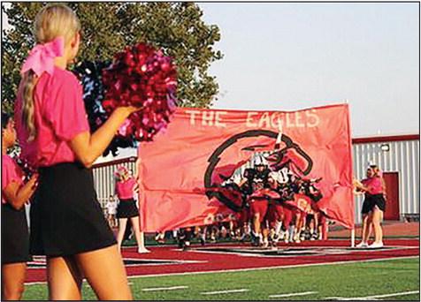 Watonga Eagle football players pour onto the field prior to Firday night’s game against Thomas-Fay-Custer. Photo Courtesy of Abbi’s Photography