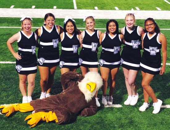 (Above) The Watonga High School varsity cheerleaders pose for a picture on the field with the Eagles’ mascot on Sept. 13, 2019, prior to Watonga’s 22-14 victory over the Alva Goldbugs in a game held at Northwestern Oklahoma State University. Tryouts for the incoming 2020-21 varsity squad will be held from July 15-18. Photo Courtesy of Becky Cope The Geary Star
