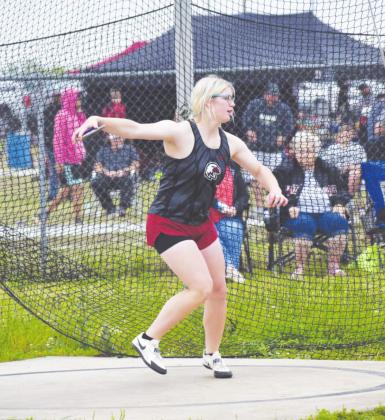 Left: Josey Rinehart competes in the discus throw in Okemah. Rinehart finished the event in second place with a top throw of 104’7”.