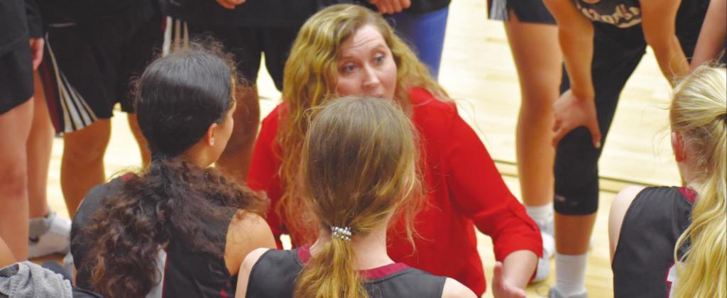 Watonga girls coach Lauren Campo gives her team instruction during a break in play.