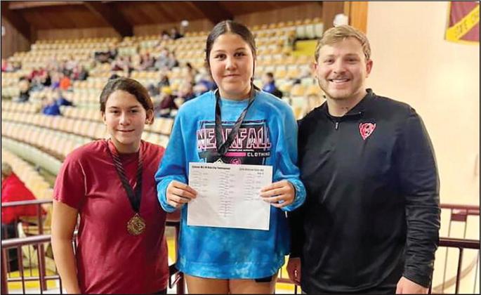 Brock Daniels coached Hollis Harrall to first in her wrestling division and Maddy Evey to third in her division at a Jan. 20 meet. Photo courtesy Geary Public Schools