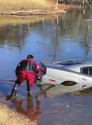 Inclement Weather Sends Car Into Geary Pond