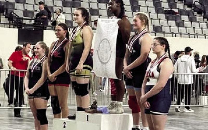(ABOVE AND AT RIGHT) Madison Evey placed fourth at the junior high state wrestling championships. There were 33 girls in her bracket. She had a great tournament.