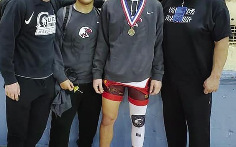 Coach Grant Williams, Ernesto Duenez, Tristian Dobbins and Jason Dobbins at the All State Wrestling Meet in Oklahoma City.