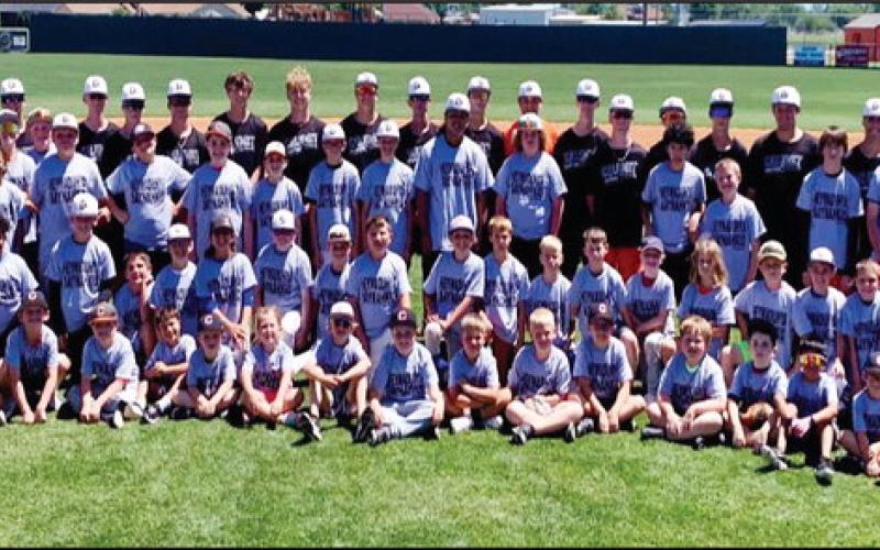 ABOVE In spite of some less than cooperative weather, the Calumet baseball camp was well attended and judging by these youngsters’ smiles, a good time was had by those in attendance.