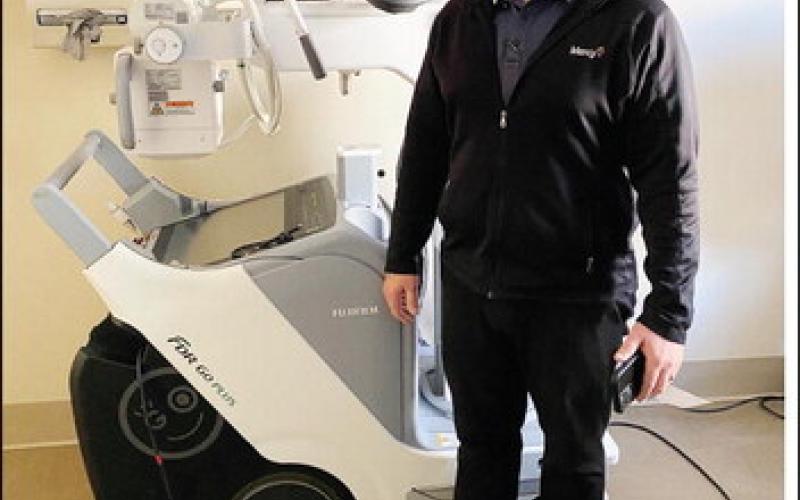 Kenny Thompson, Operations Managerfor Mercy Hospital Watonga, is shown with the facility’s new portable X-ray machine. Imaginging upgrades improve care, diagnosises and treatments.