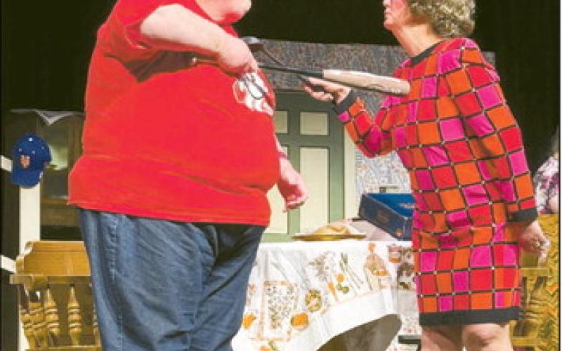(AT LEFT) Amy Adams (L) as Olive Madison threatens Kim Coney (R) as Florence Unger in the Odd Couple Female Version being produced at the Watonga Community Theater. ( BELOW) The cast, crew and director of the Odd Couple Female Version