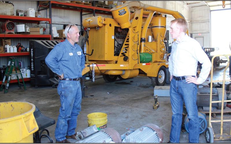 U.S. Senator james lankford paused Thursday during a tour of Wheeler Brothers to visit with one of the long time employees who was repairing motors for the company.