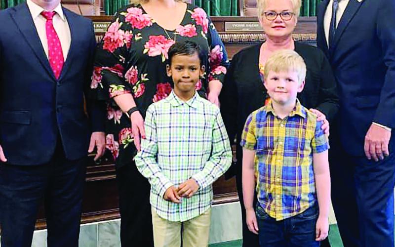 Watonga first graders J.T O’Dell and Treyson Harper were honored for winning first place in writing and art in the OBA Law Day contest. The young men met Sen. Darcy Jech and Rep. Mike Dobrinski. Chief Justice John Kane IV presented their awards at the Oklahoma State Capitol. Shown are (L-R) Watonga Superintendent Kyle Hilterbran, teacher April Schrader, teacher Micki Urbanczyk, Sen. Jech, J.T. O’Dell and Treyson Harper.