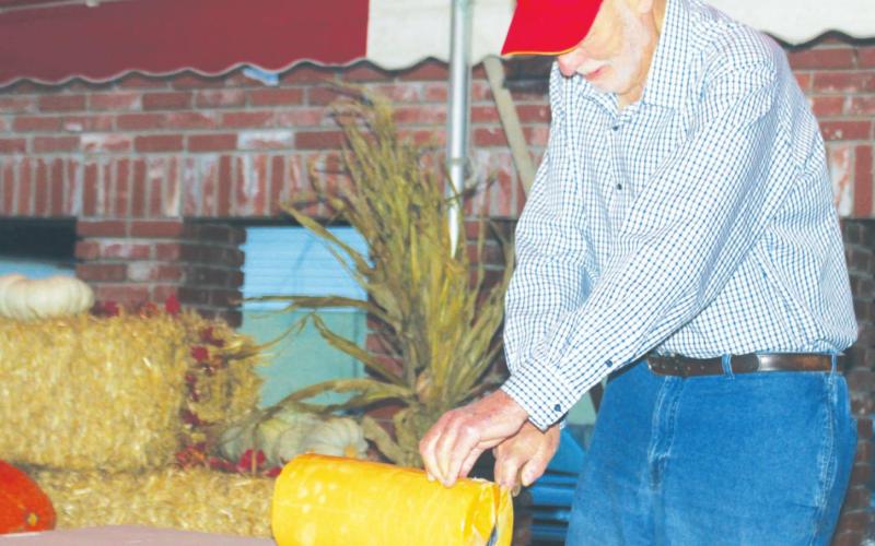 Former Watonga Mayor Gary Olsen cuts the cheese – a block of Watonga cheese, that is – in 2018 to officially kick off the festival. The ceremonial cutting of cheese will take place at 6:00 p.m. Thursday Oct. 7 at Centennial Park.