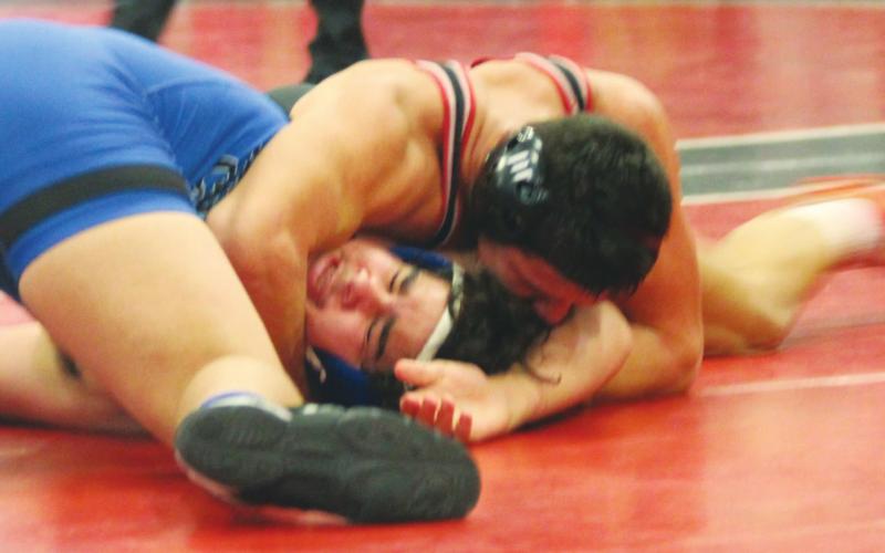 (Above) Geary High School 182-pound varsity senior wrestler Landon Holt pins opponent Shane Lundy of Bridge Creek High School on Feb. 21 in a first-round matchup at the 2020 Class 3A Regional Wrestling Tournament held at Stegall-Long Fieldhouse in Geary. Andrew Salmi | The Geary Star