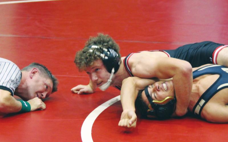 (Below) Bison varsity wrestling 160-pound senior Max Glasgow records a fall against opponent Paul Sullivan of Woodward High School on Dec. 20, 2019 at the annual Max Dippel Memorial wrestling tournament held at Weatherford High School.
