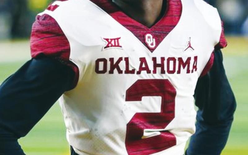 Ray Carlin AP Photo (Above) Former University of Oklahoma standout wide receiver CeeDee Lamb stands on the fiel;d on Nov. 19, 2019 during warmups prior to an NCAA college football game vs. Baylor University in Waco, Texas. Lamb was selected by the Dallas Cowboys on April 26 in the first round of the 2020 NFL Draft.