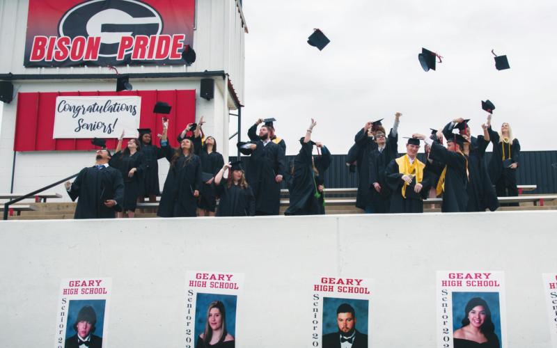 Geary High School seniors from the Class of 2020 throw their caps into the air May 16 in the traditional salute to the end of their high school career. It was one of a few traditions that survived the revamping of the commencement ceremony, which was overhauled to meet Covid-19 restrictions on gathering sizes and attendee spacing. Maggie Base/Geary Public Schools | Watonga Republican