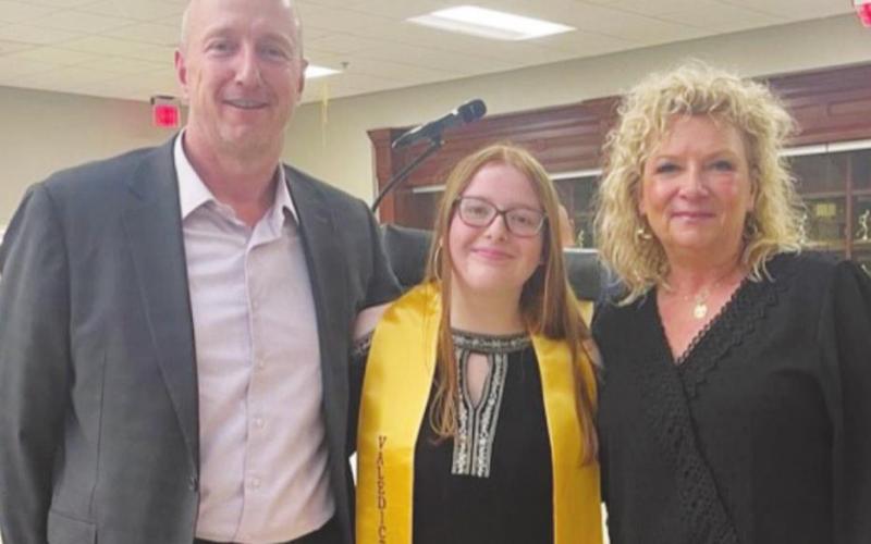 Harley Petty (middle) was selected to receive a $1,000 scholarship award to support her first year of studies at the University of Oklahoma