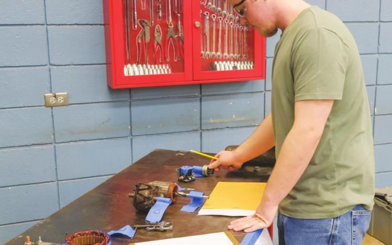 Gannon Grubs, Watonga home-school student, chooses from a selection of automotive parts at the Division SkillsUSA contest in Fairview. He placed fourth in his category. CTTC | Watonga Republican