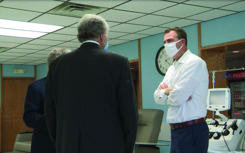 Oklahoma Gov. Kevin Stitt talks with staff during his visit to Oklahoma Blood Center at Enid