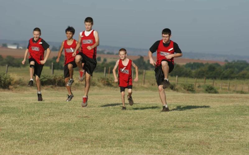 Cy Walters performing warm-up exercises before a meet. Cy was born pre-mature and was a small kid growing up. “All the other boys were really big and tall, and here’s teeny, tiny Cy,” his mother, Stacey, said.
