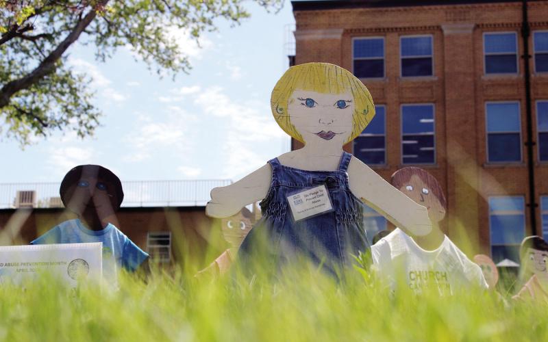 The wooden chidlren scattered around Watonga represent the child abuse and neglect cases investigated in Blaine County this year. But they also respresent the hope that CASA offers to the youngest victims.