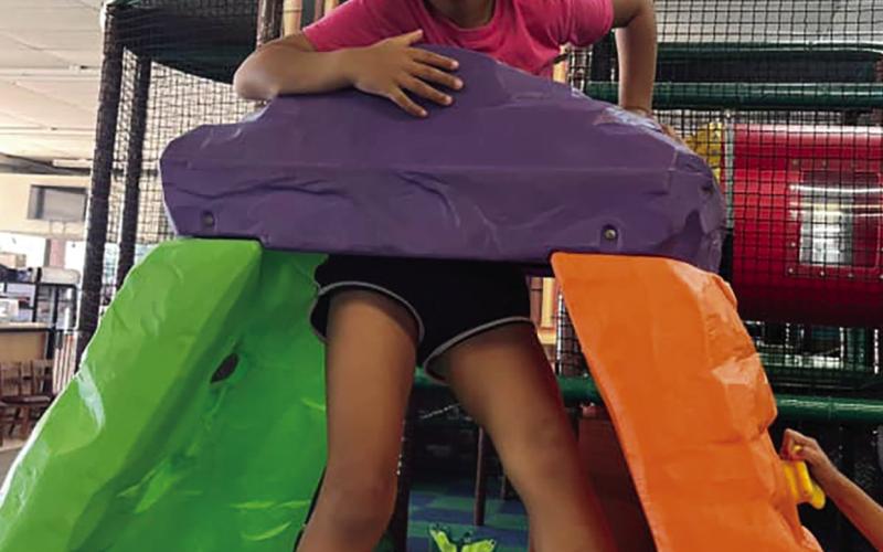 spacial relationships by determining whether they fit through the center of the jungle gym. (BELOW AT LEFT) It’s never too early to start preparing for early childhood learning.