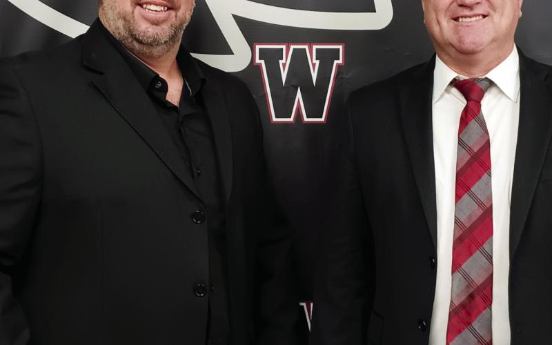 Matt Walter with Watonga Superintendent Kyle Hilterbran. Walter was named head football coach Monday night.