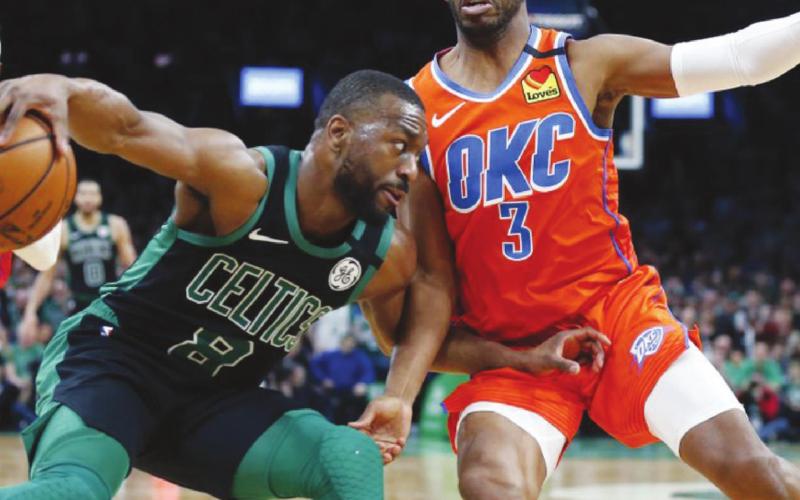 (Above) Oklahoma City Thunder point guard Chris Paul (3) puts defensive pressure on Boston Celtics'point guard Kemba Walker (8) in the back court on March 8 during OKC’s 105-104 win at TD Garden in Boston. This was the Thunder’s final game played before all NBA games were postponed indefinitely due to the COVID-19 situation that has affected all sports leagues. Michael Dwyer AP Photo
