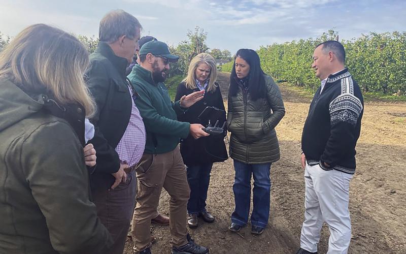 Oklahoma’s Secretary of Agriculture, Blayne Arthur, 9Secnd from right) discusses drone usage for agricultural applications during a tour of the United Kingdon in 2021.