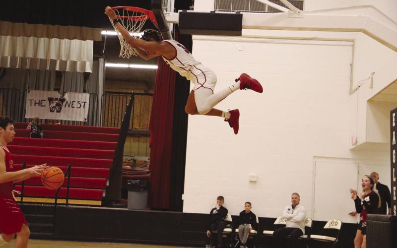 Above: A Watonga player dunks and gets some serious hang time against Hinton Nov. 29 At left: The Watonga Lady Eagles faced off against Hinton Nov. 29 and came away with a win. Both the Eagles and the Lady Eagles will play next at the Minco Tournament. The boys’ opponent is to be determined, while the girls will play Carnegie fin the first round. Photos provided by Piper Gallagher